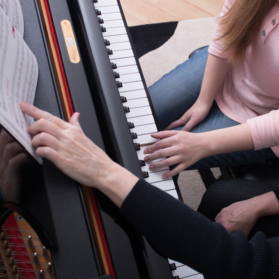Finger placement from female student learning to play piano